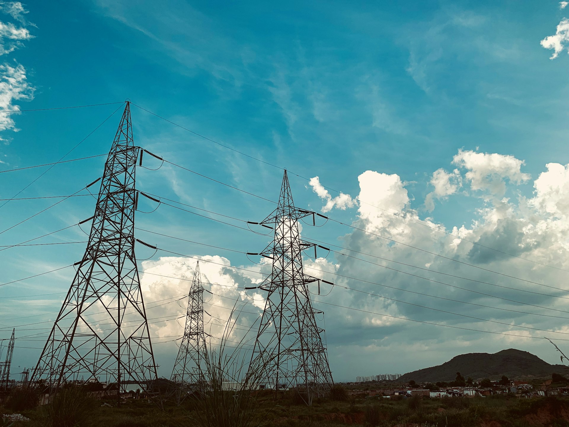 Texas power transmission lines across a green daylight landscape